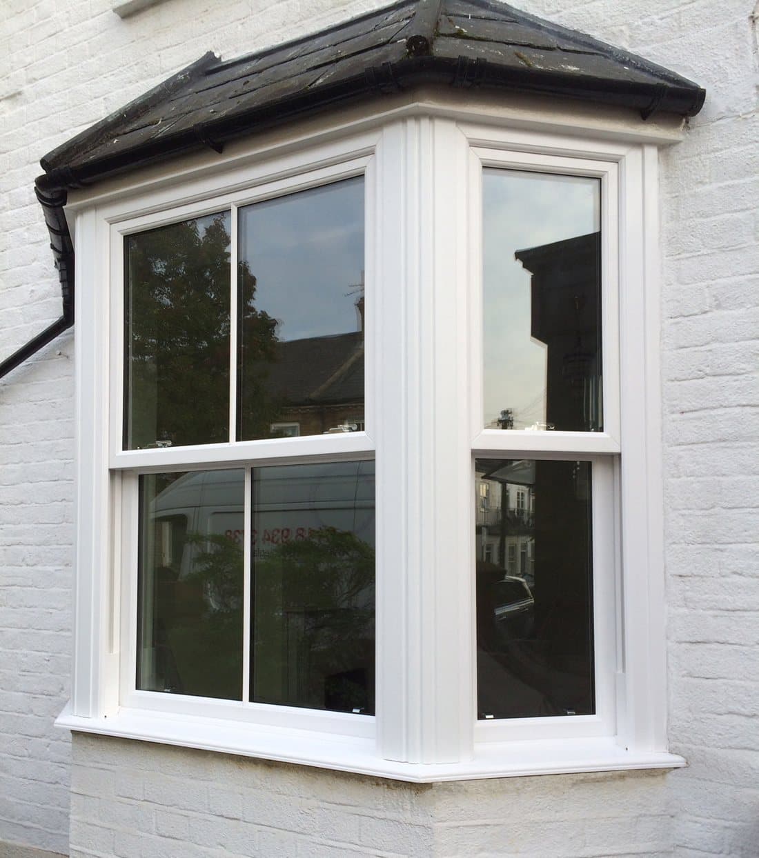 White sliding sash bay