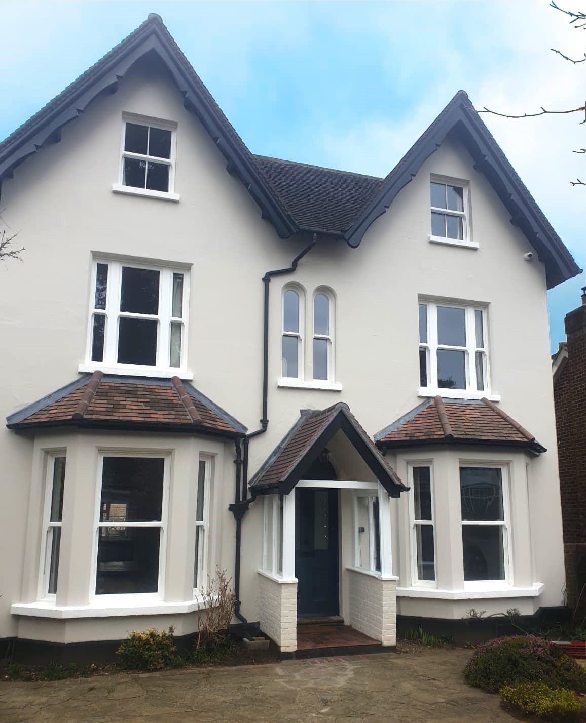 A white rendered period villa fitted throughout with white sliding sash windows